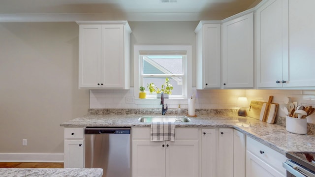 1105 18th St NW, Cleveland, TN 37311 - kitchen with dishwasher, a sink, decorative backsplash, and white cabinetry