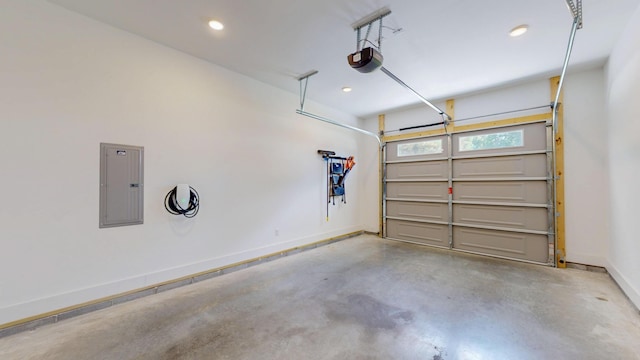 1105 18th St NW, Cleveland, TN 37311 - garage with electric panel, a garage door opener, baseboards, and recessed lighting