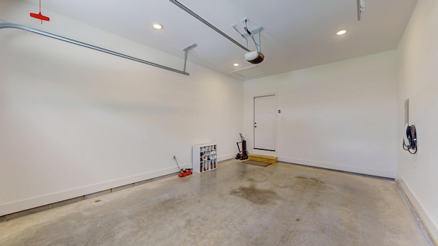 1105 18th St NW, Cleveland, TN 37311 - garage with recessed lighting, baseboards, and a garage door opener