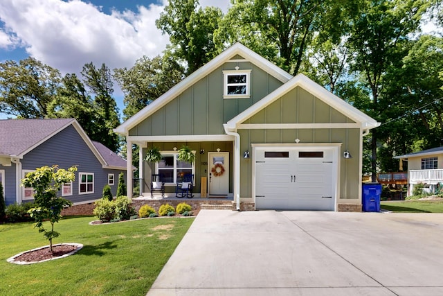 1105 18th St NW, Cleveland, TN 37311 - view of front of home featuring a porch, board and batten siding, a front lawn, driveway, and an attached garage