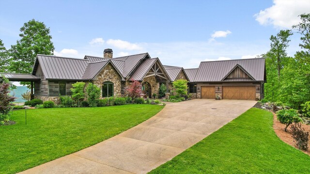 6835 Jasper Highlands Blvd, Jasper, TN 37347 - view of front facade with stone siding, a standing seam roof, a chimney, driveway, and a garage