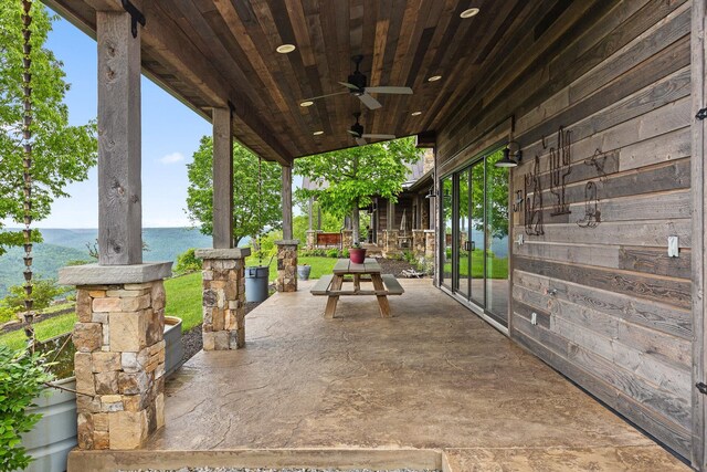 6835 Jasper Highlands Blvd, Jasper, TN 37347 - view of patio / terrace with a water view and a ceiling fan