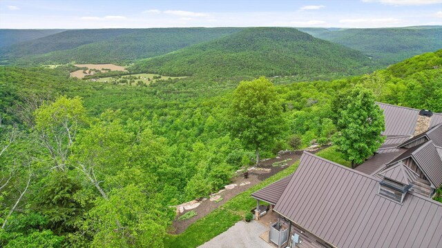 6835 Jasper Highlands Blvd, Jasper, TN 37347 - aerial view of property and surrounding area featuring a forest and a mountainous background