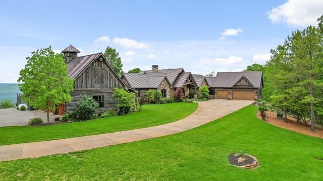 6835 Jasper Highlands Blvd, Jasper, TN 37347 - tudor home with a standing seam roof, metal roof, stone siding, a front lawn, and driveway
