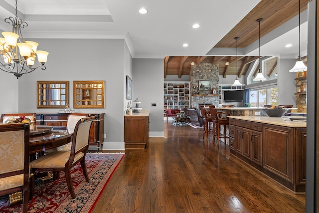 6835 Jasper Highlands Blvd, Jasper, TN 37347 - dining space with a chandelier, dark wood-type flooring, recessed lighting, crown molding, and a stone fireplace