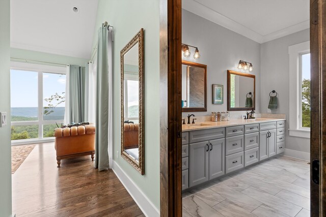 6835 Jasper Highlands Blvd, Jasper, TN 37347 - full bathroom with healthy amount of natural light, baseboards, double vanity, a water view, and ornamental molding