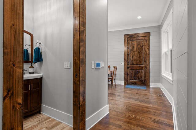 6835 Jasper Highlands Blvd, Jasper, TN 37347 - hall featuring baseboards, wood finished floors, wood walls, ornamental molding, and recessed lighting