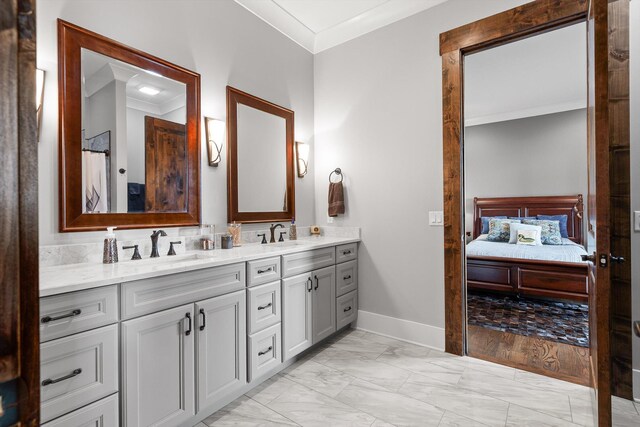6835 Jasper Highlands Blvd, Jasper, TN 37347 - ensuite bathroom featuring marble finish flooring, crown molding, baseboards, and double vanity