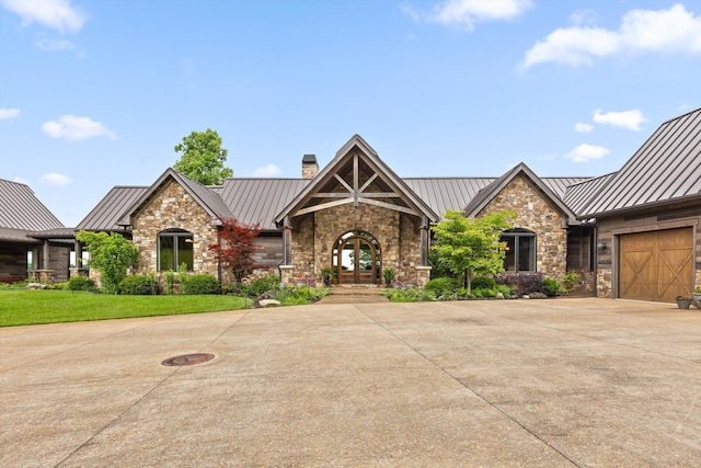 6835 Jasper Highlands Blvd, Jasper, TN 37347 - craftsman house with a standing seam roof, a chimney, stone siding, driveway, and metal roof