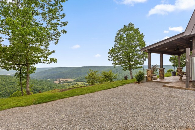 6835 Jasper Highlands Blvd, Jasper, TN 37347 - view of yard featuring ceiling fan, a patio, and a mountain view