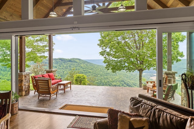 6835 Jasper Highlands Blvd, Jasper, TN 37347 - doorway to outside with lofted ceiling, wood finished floors, ceiling fan, and a mountain view