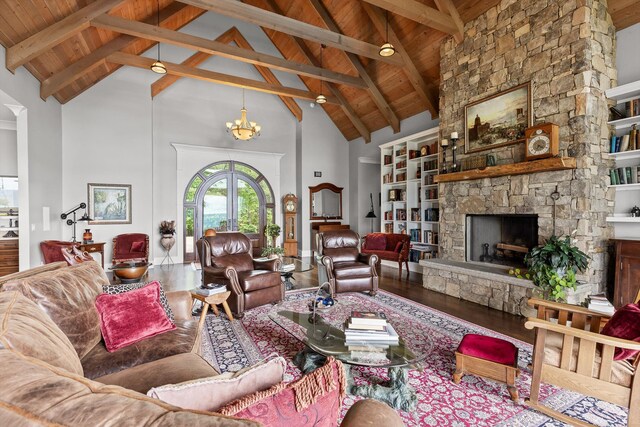 6835 Jasper Highlands Blvd, Jasper, TN 37347 - living room featuring high vaulted ceiling, wooden ceiling, wood finished floors, a stone fireplace, and beam ceiling