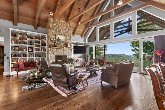 6835 Jasper Highlands Blvd, Jasper, TN 37347 - living area with high vaulted ceiling, wood finished floors, a fireplace, beam ceiling, and wooden ceiling
