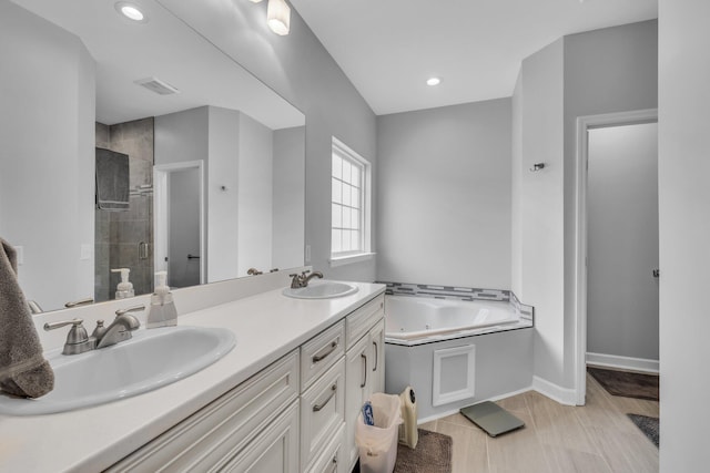 7861 Laurelton Dr, Chattanooga, TN 37421 - bathroom featuring a shower stall, a tub with jets, double vanity, baseboards, and recessed lighting