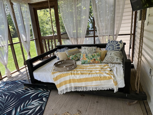 sunroom / solarium with healthy amount of natural light and an outdoor living space