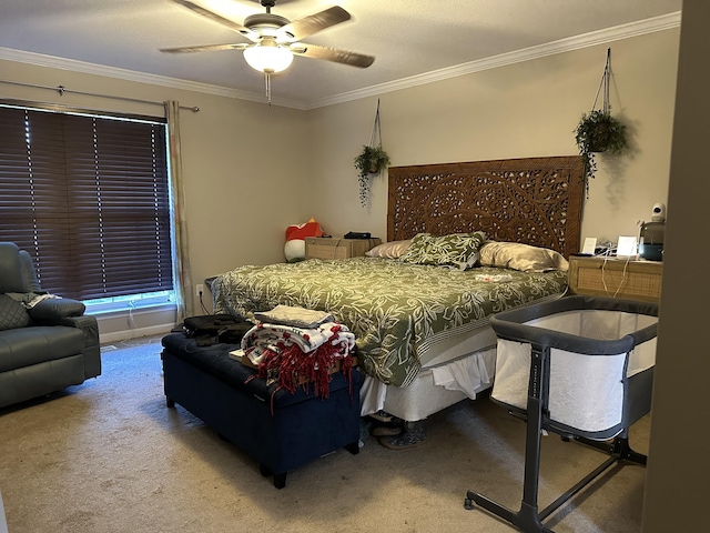 carpeted bedroom with crown molding and a ceiling fan