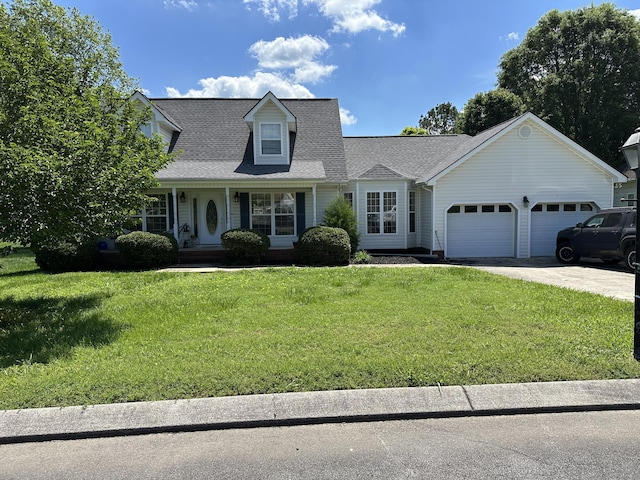 cape cod house with an attached garage, a front lawn, concrete driveway, and roof with shingles