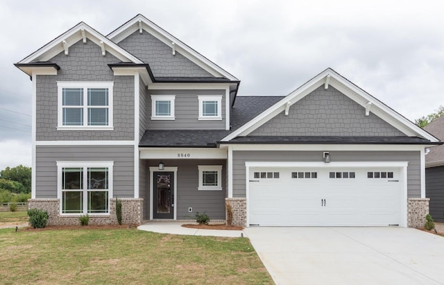 8880 Knolling Loop Unit 35, Ooltewah, TN 37363 - craftsman-style house with brick siding, a front lawn, concrete driveway, and a garage