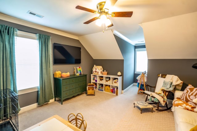 playroom featuring a ceiling fan, light colored carpet, baseboards, and lofted ceiling