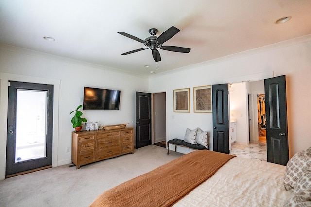 bedroom featuring crown molding, light colored carpet, a ceiling fan, and connected bathroom