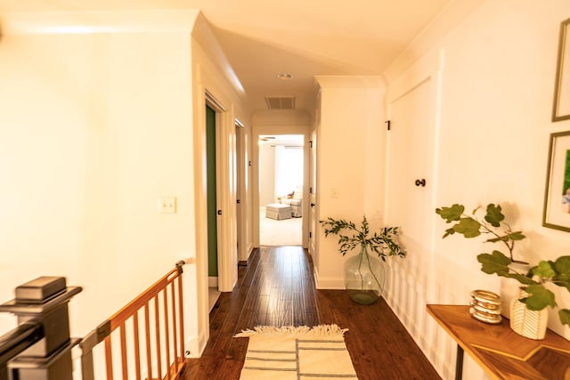 corridor with dark wood-type flooring, recessed lighting, and baseboards