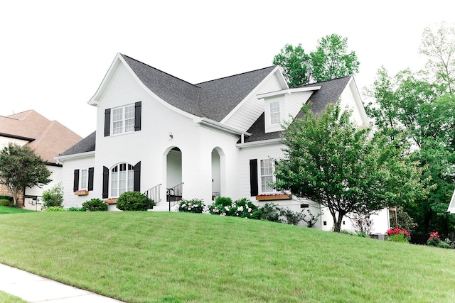 9405 Peppy Branch Trl, Apison, TN 37302 - view of front of property with a front lawn, roof with shingles, and brick siding