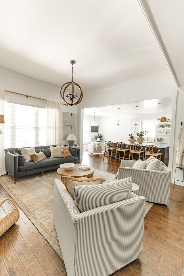9405 Peppy Branch Trl, Apison, TN 37302 - living room featuring a chandelier, wood-type flooring, and plenty of natural light