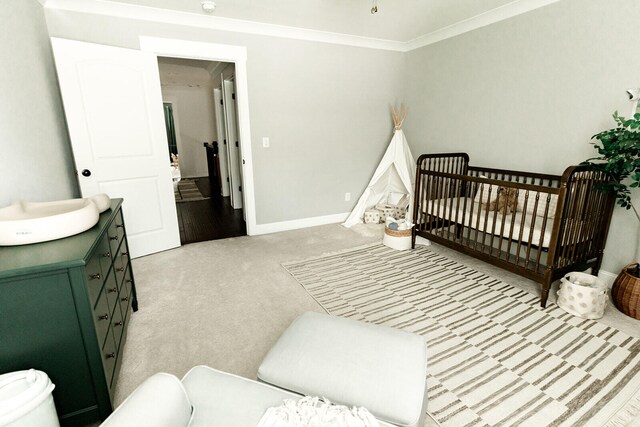 9405 Peppy Branch Trl, Apison, TN 37302 - bedroom featuring light carpet, baseboards, a nursery area, and crown molding