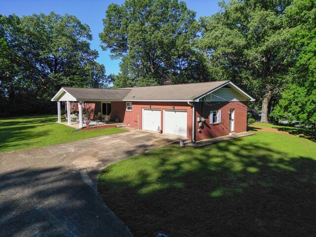1106 Browns Ferry Rd, Chattanooga, TN 37419 - ranch-style house featuring a garage, driveway, a front lawn, brick siding, and a porch