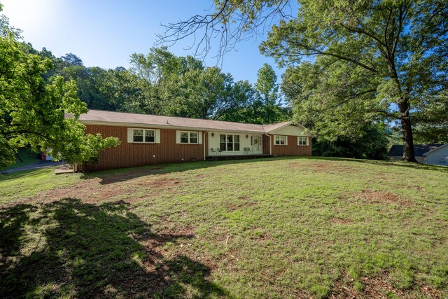 1106 Browns Ferry Rd, Chattanooga, TN 37419 - view of front of property with brick siding and a front lawn
