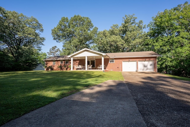 1106 Browns Ferry Rd, Chattanooga, TN 37419 - single story home with an attached garage, driveway, brick siding, a front lawn, and covered porch