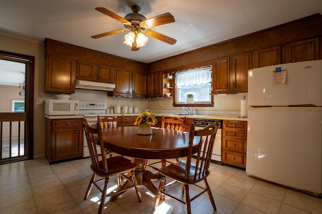 1106 Browns Ferry Rd, Chattanooga, TN 37419 - kitchen with white appliances, under cabinet range hood, a ceiling fan, light countertops, and crown molding