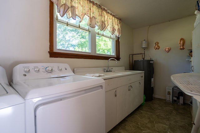 1106 Browns Ferry Rd, Chattanooga, TN 37419 - washroom featuring water heater, separate washer and dryer, and cabinet space