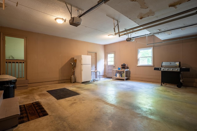 1106 Browns Ferry Rd, Chattanooga, TN 37419 - garage featuring freestanding refrigerator and a garage door opener