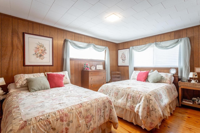 1616 Crappie Cir, Soddy Daisy, TN 37379 - bedroom with wooden walls and light wood-style floors