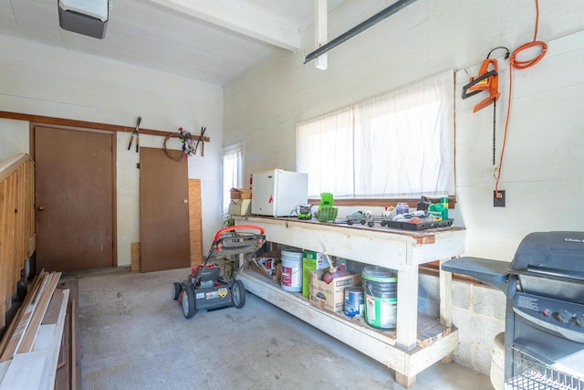 1616 Crappie Cir, Soddy Daisy, TN 37379 - garage featuring a garage door opener and a workshop area