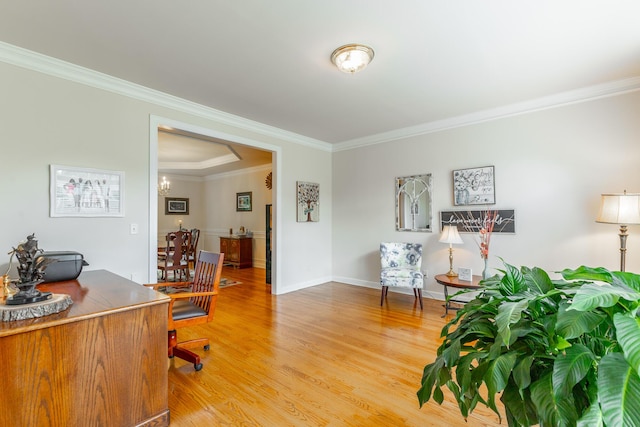 home office with ornamental molding, light wood finished floors, a chandelier, and baseboards