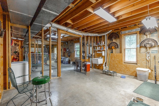below grade area with a sink and plenty of natural light