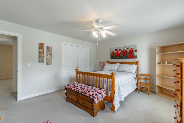 bedroom with carpet flooring, baseboards, and a ceiling fan