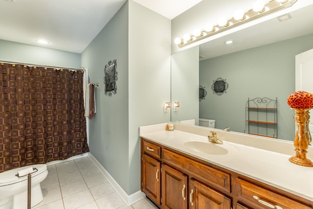 bathroom featuring toilet, tile patterned floors, vanity, baseboards, and curtained shower