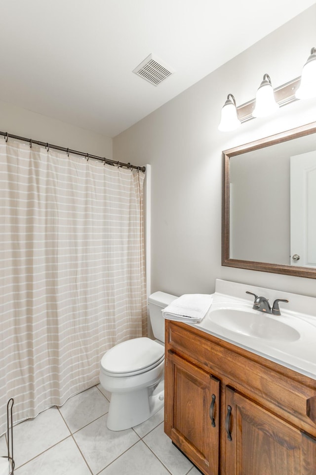 full bathroom featuring toilet, tile patterned flooring, vanity, and a shower with shower curtain