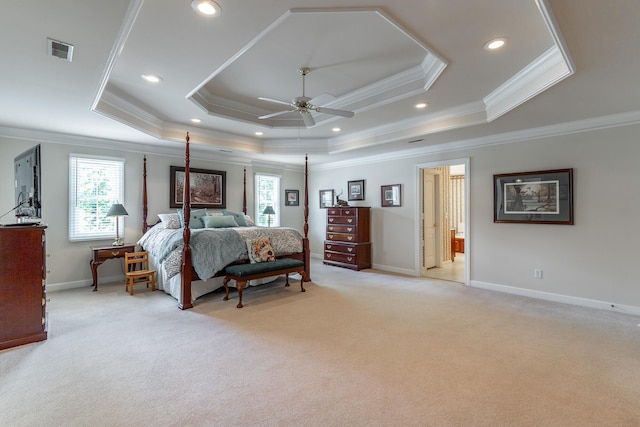bedroom with multiple windows, light colored carpet, crown molding, a raised ceiling, and baseboards