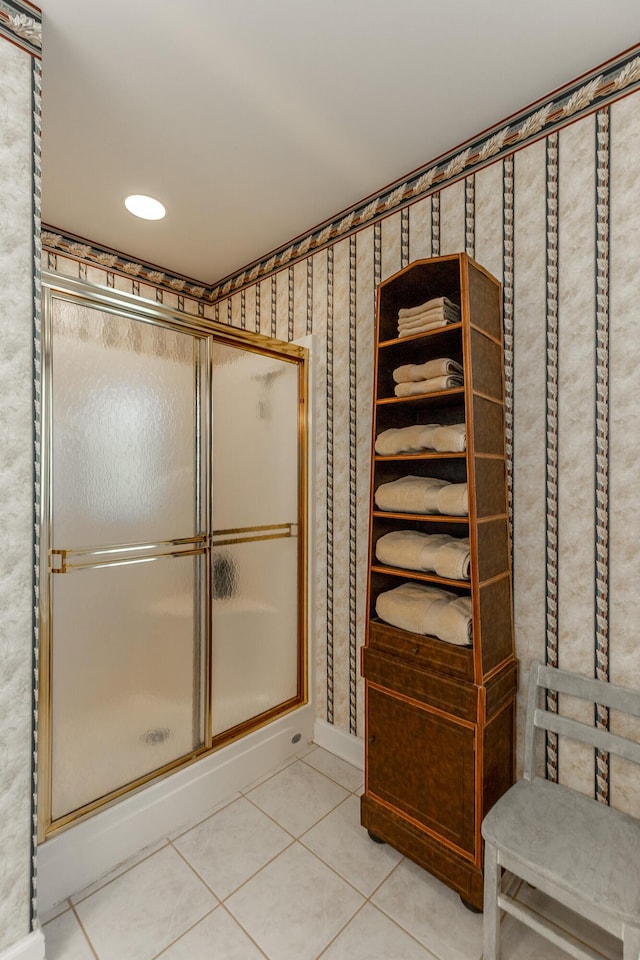 bathroom with tile patterned flooring and a stall shower
