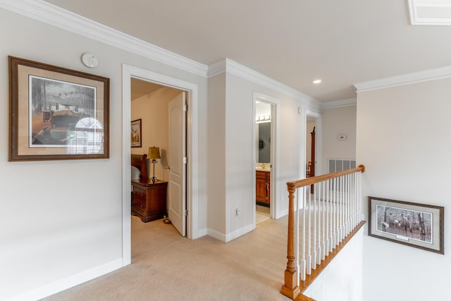 hallway with an upstairs landing, baseboards, light colored carpet, recessed lighting, and ornamental molding