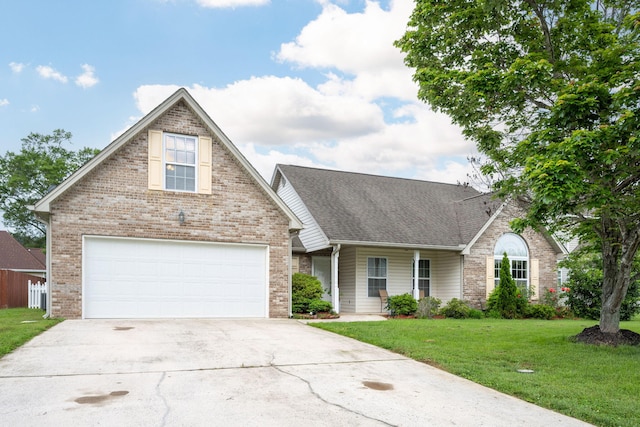 traditional home featuring driveway, a front yard, brick siding, roof with shingles, and an attached garage