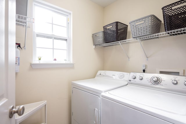 washroom featuring washing machine and dryer