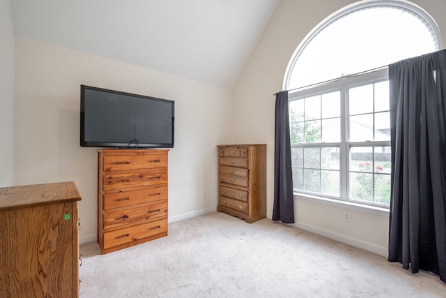 bedroom featuring carpet, baseboards, and vaulted ceiling