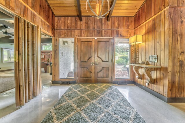 1301 W Morton Dr, Dalton, GA 30720 - entrance foyer with wooden walls, finished concrete flooring, wood ceiling, a chandelier, and beamed ceiling