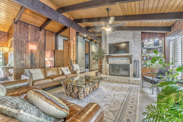 1301 W Morton Dr, Dalton, GA 30720 - living area featuring wooden walls, plenty of natural light, wooden ceiling, ceiling fan, and a brick fireplace