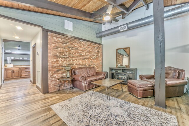 1301 W Morton Dr, Dalton, GA 30720 - living area featuring a ceiling fan, light wood-style flooring, beamed ceiling, and a high ceiling